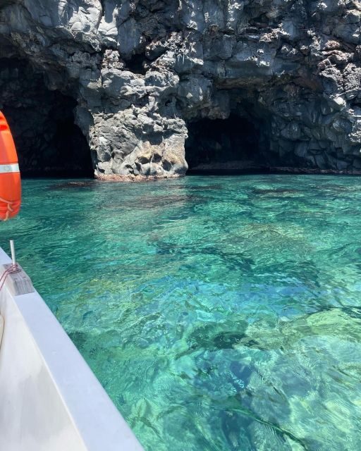 BOAT TOUR WITH APERITIF ON BOARD IN THE CYCLOPS ISLANDS - Aci Castello from the water: Norman Castle and lava ‘pillows’