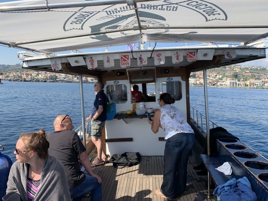 Catania: Cyclops Islands & Timpa Nature Reserve Boat Tour - On the water with Andrea and crew: boat comfort, snacks, and clear explanations