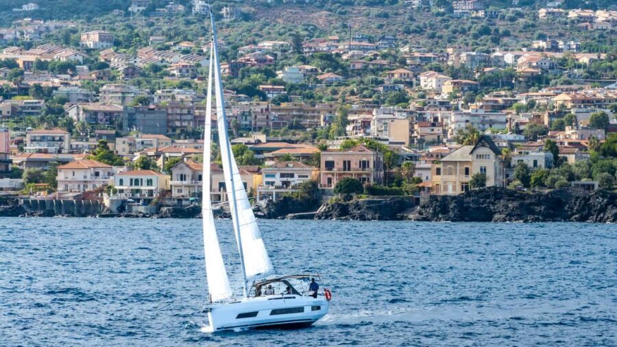 Catania: Sail Tour of Cyclops Coast with Sicilian Aperitif - Aci Trezza water stop: swimming, snorkeling, and SUP in one block