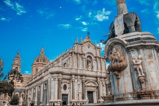 Discover Catania from fabulous viewpoints with your personal photographer - Stop 2: Sant’Agata Abbey dome views, stairs, and Etna clouds